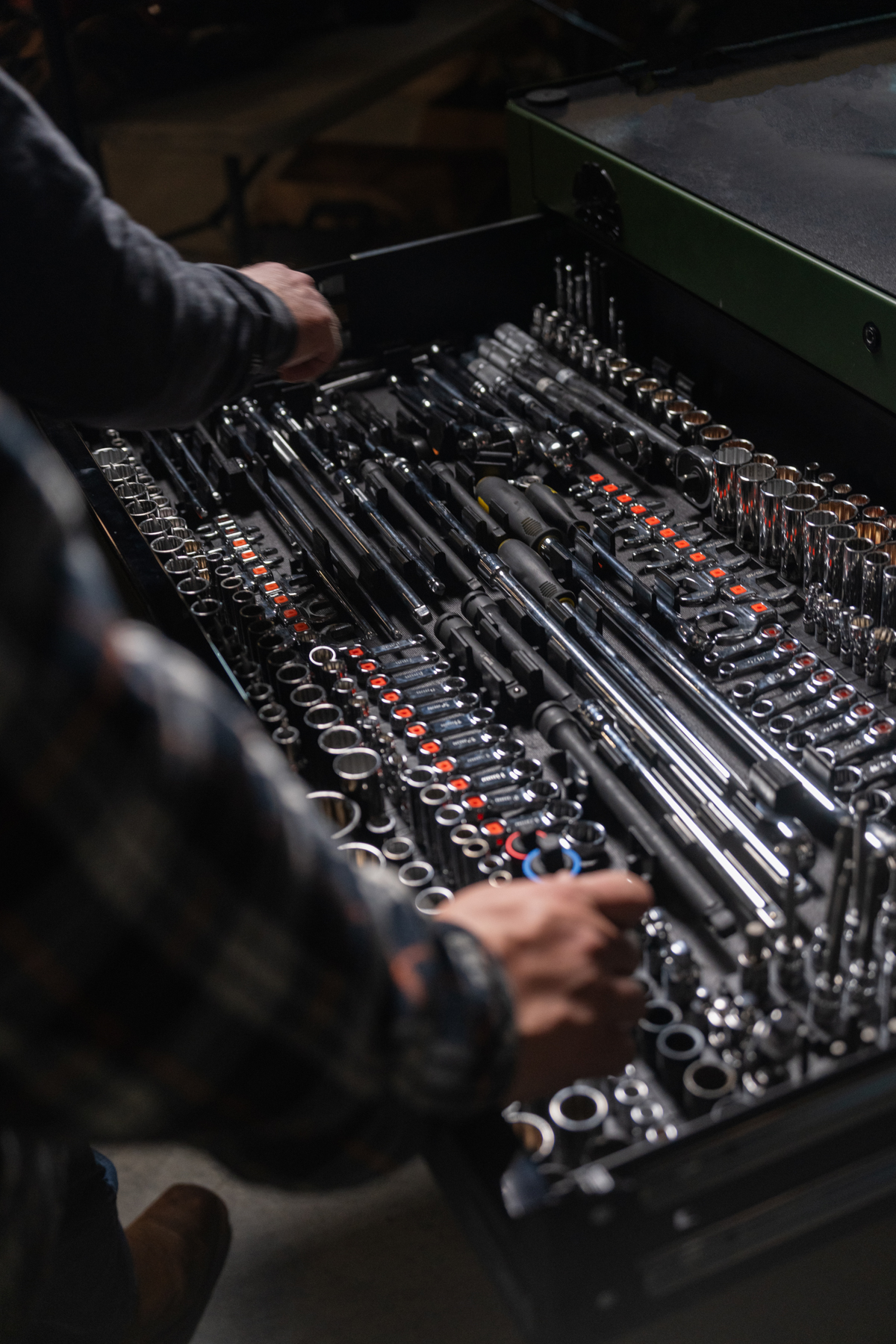 Tool drawer neatly organized with rows of chrome sockets and extensions