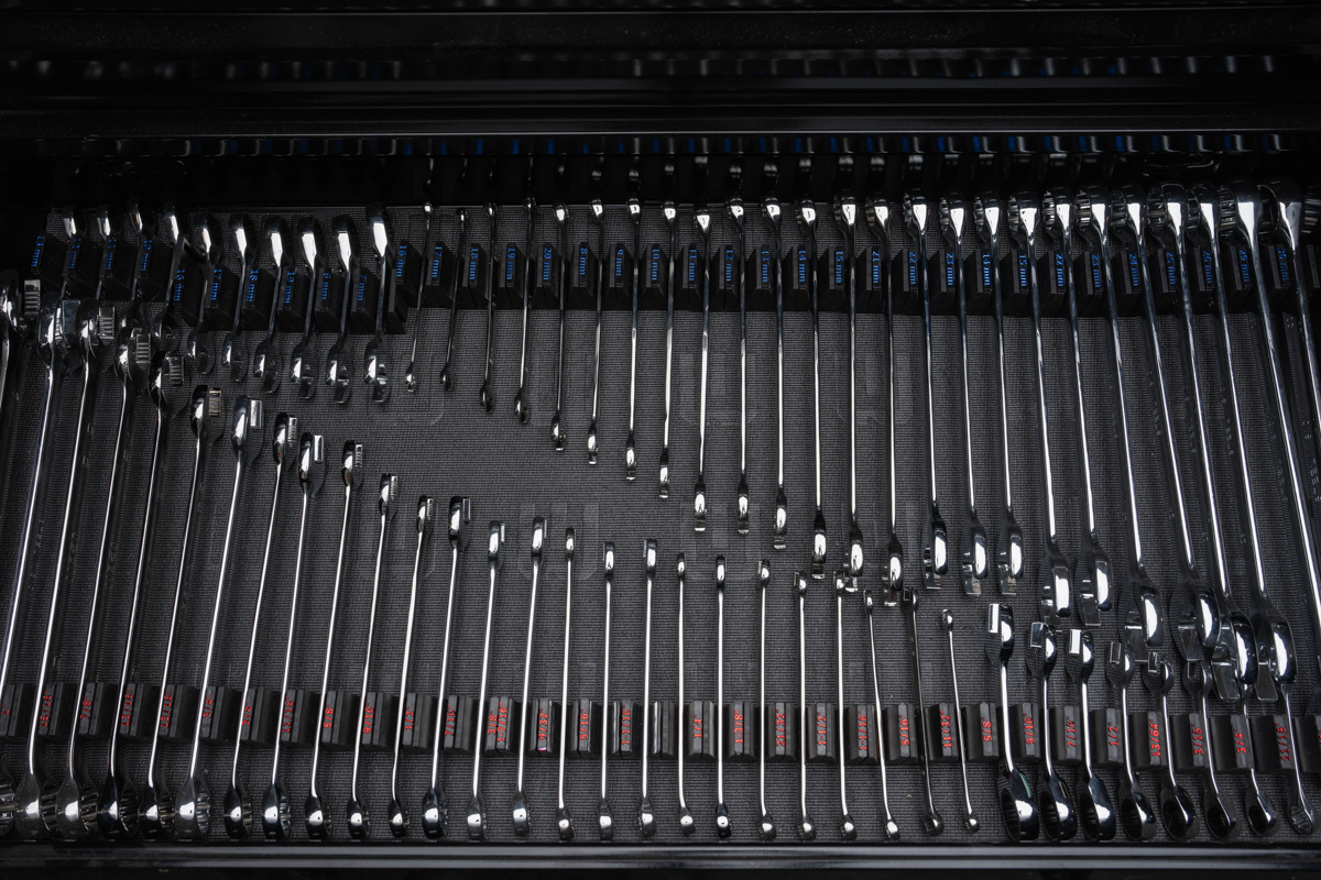 Tool drawer with wrenches neatly organized using vertical modular organizers — locked in place after transit