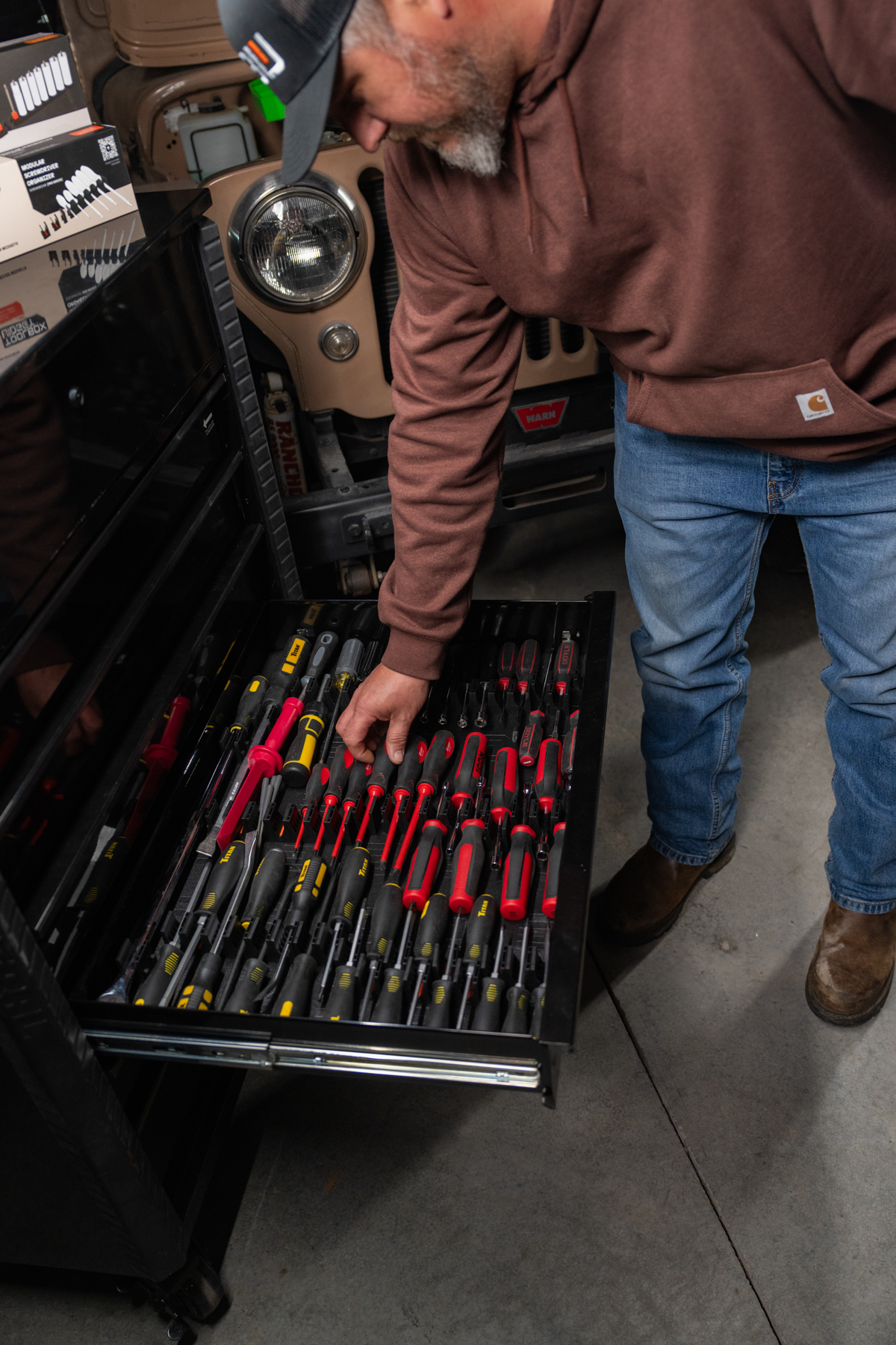 Storage drawer with pliers and wrenches organized in modular holders