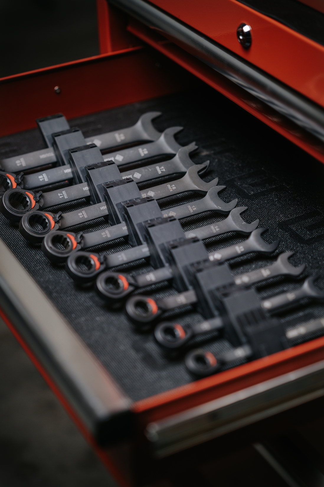 Close-up of the Large Angled Wrench Organizer holding big wrenches inside an organized toolbox